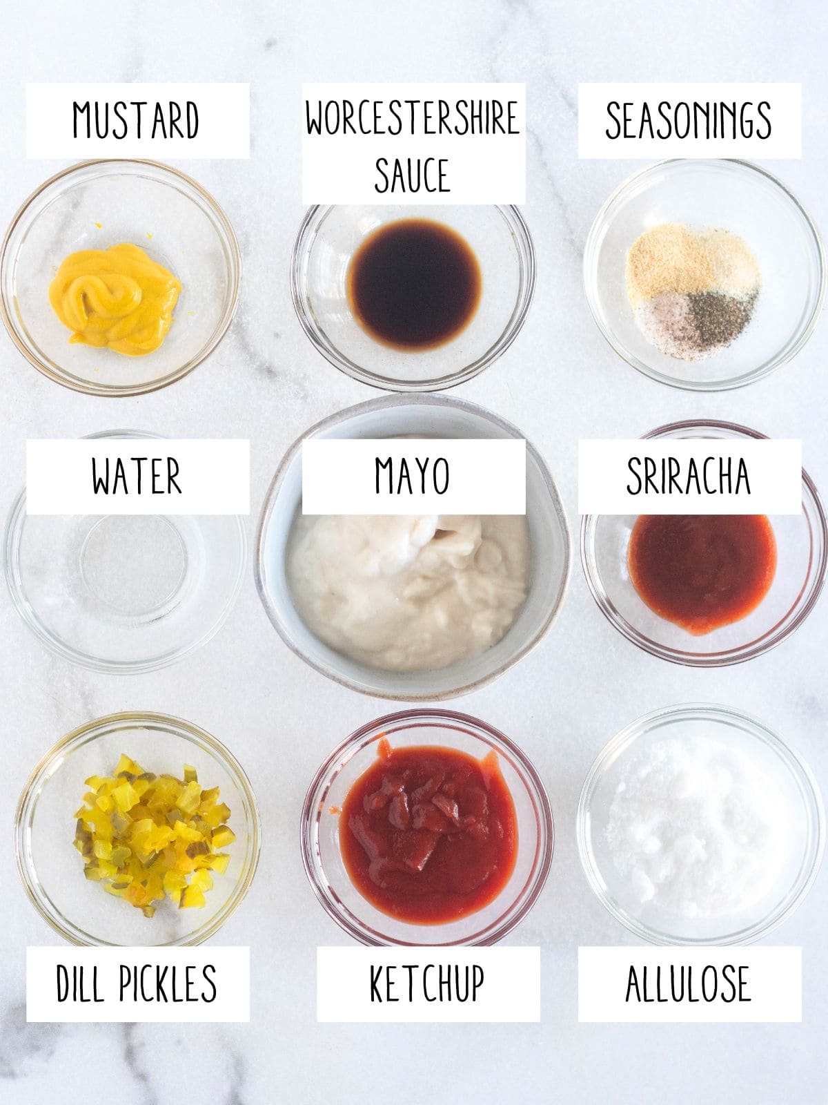 sauce ingredients in bowls with labels.